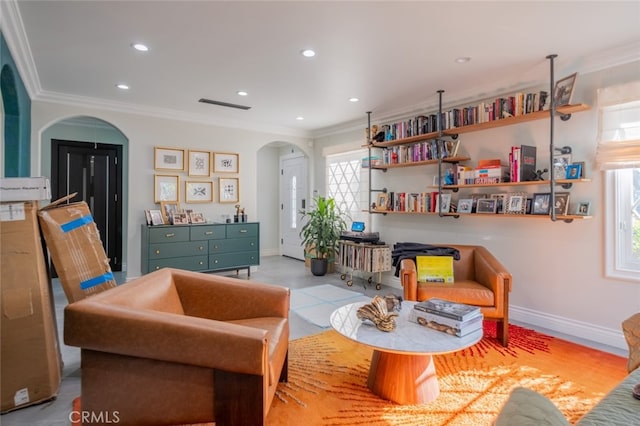 living area with ornamental molding