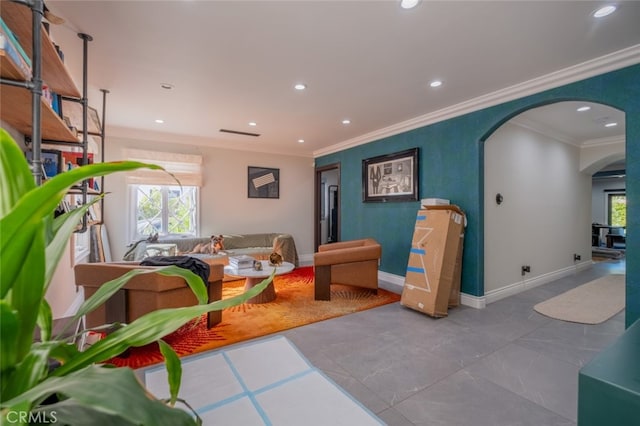 recreation room with light tile patterned floors and crown molding