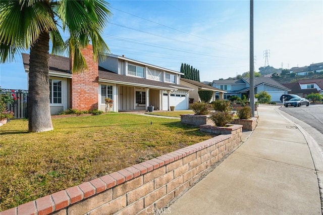 view of front of property with a garage and a front yard