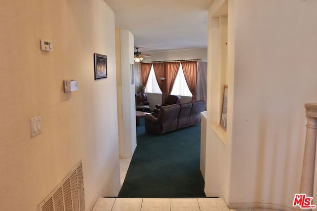 corridor featuring light tile patterned flooring