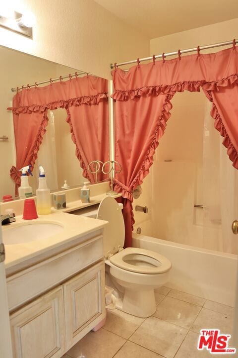 full bathroom with toilet, tile patterned floors, shower / bath combo, and vanity