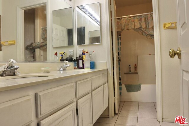 bathroom with tile patterned floors, vanity, and shower / bath combo