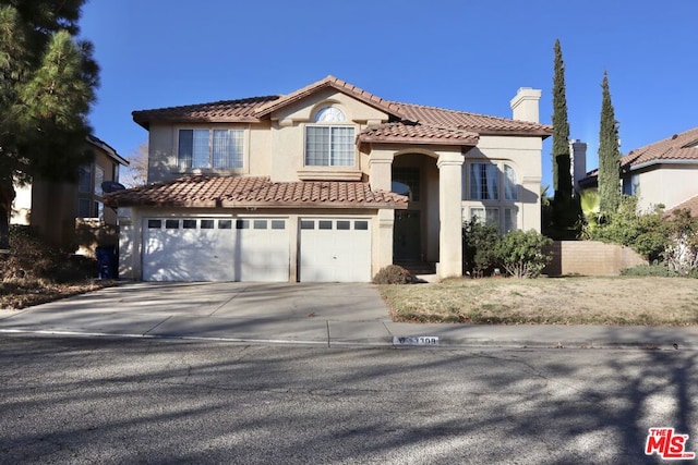 view of front of property with a garage