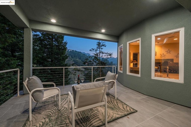 view of balcony at dusk