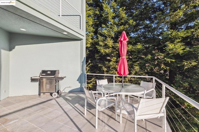 view of patio featuring a balcony and area for grilling