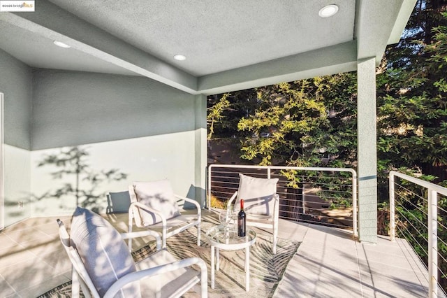 view of patio / terrace with a balcony