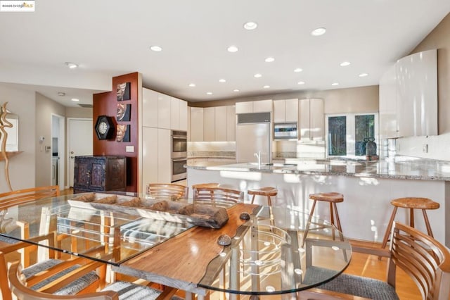 dining space featuring light hardwood / wood-style flooring