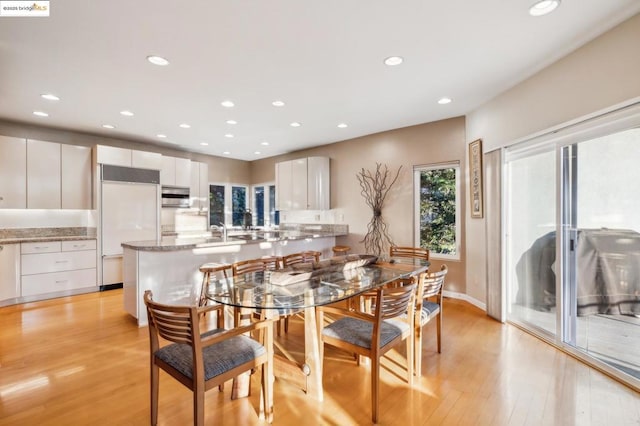 dining space featuring light hardwood / wood-style flooring