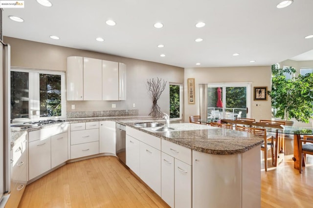 kitchen featuring sink, stainless steel appliances, and white cabinetry