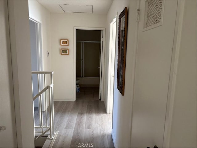 hall with light hardwood / wood-style floors