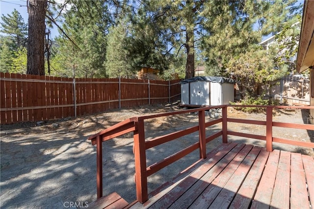 deck featuring a storage shed