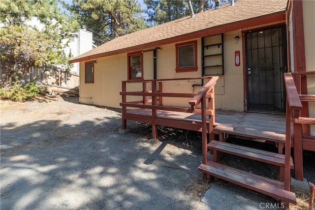 doorway to property with a deck