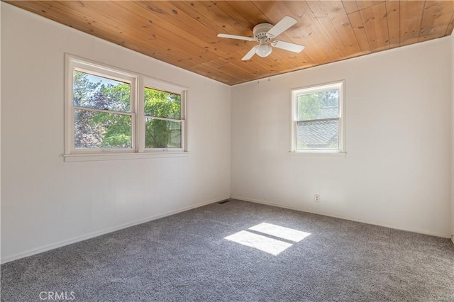 unfurnished room with wooden ceiling, carpet flooring, and ceiling fan