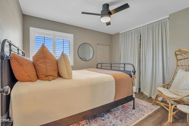 bedroom featuring ceiling fan and wood-type flooring