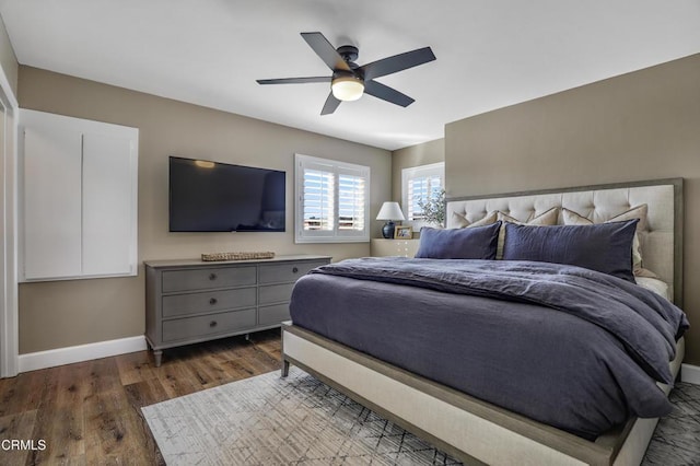 bedroom featuring ceiling fan and dark hardwood / wood-style floors