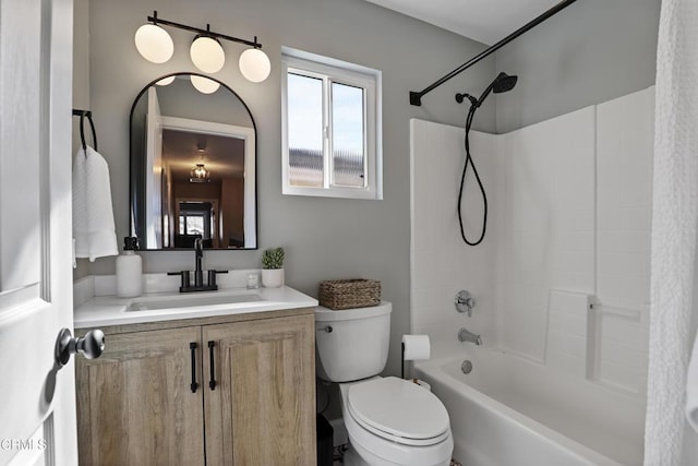 full bathroom featuring washtub / shower combination, toilet, and vanity