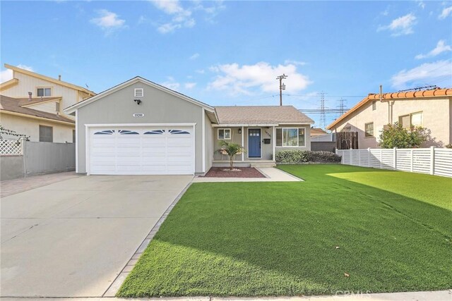 view of front of property with a front yard and a garage