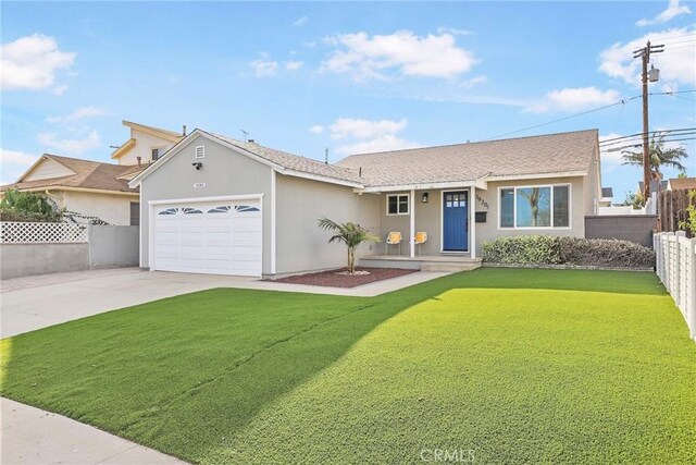 ranch-style home featuring a front yard and a garage