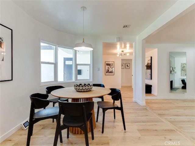 dining room with light wood-type flooring