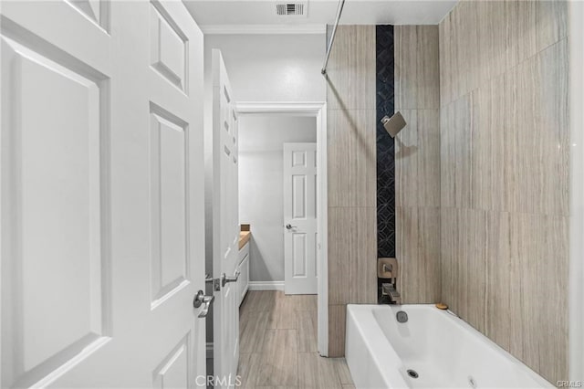 bathroom with bathing tub / shower combination and crown molding