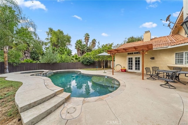 view of pool featuring a patio area and french doors