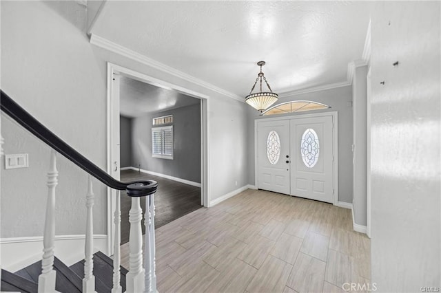 entryway featuring crown molding