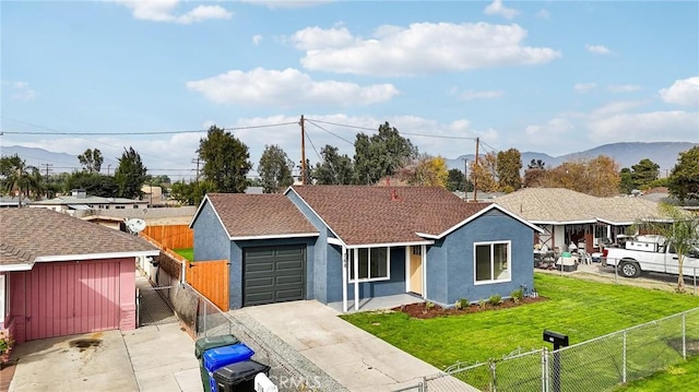 single story home with a mountain view and a front lawn