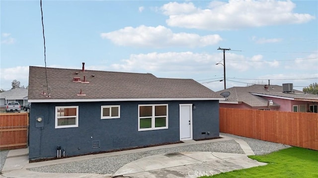 back of house featuring central AC unit and a patio