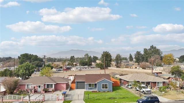 birds eye view of property with a mountain view