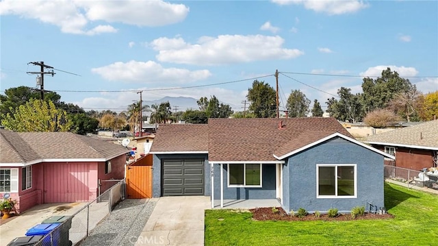 single story home featuring a garage, a front yard, and covered porch