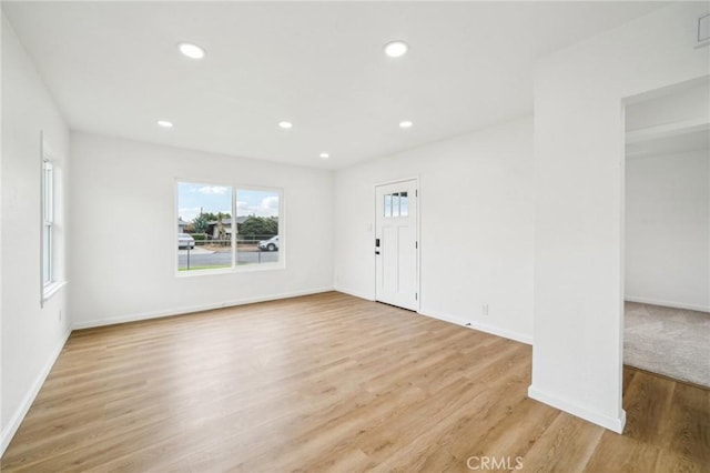 unfurnished room with light hardwood / wood-style flooring