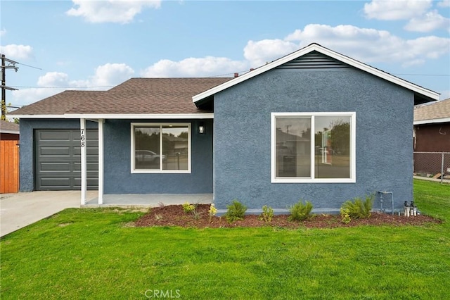 view of front facade with a front lawn and a garage