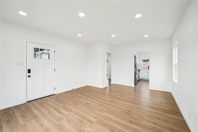 entrance foyer with light hardwood / wood-style floors