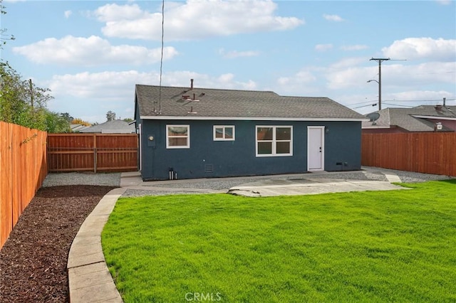 rear view of property with a lawn and a patio area