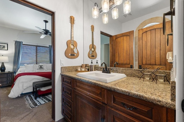 bathroom featuring ceiling fan and vanity