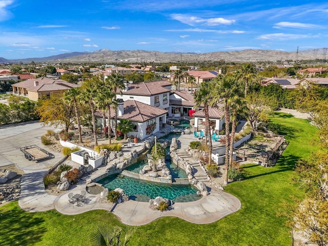 birds eye view of property featuring a mountain view