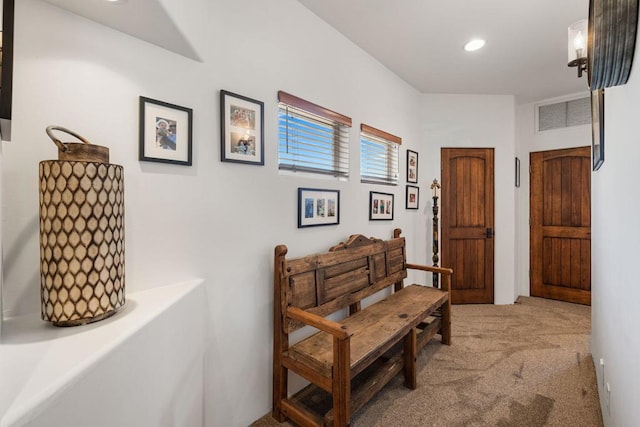 hallway featuring light carpet