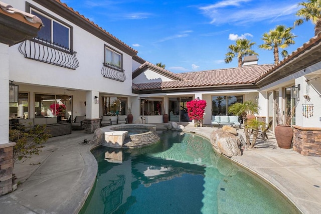 view of swimming pool with an in ground hot tub, a patio area, and an outdoor hangout area