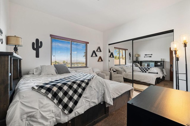 carpeted bedroom with a closet