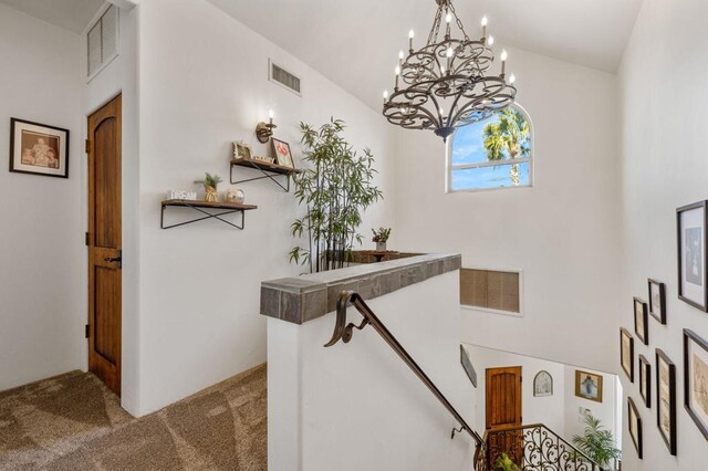 interior space with vaulted ceiling and carpet flooring