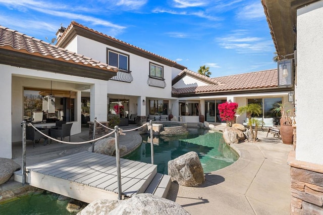 view of pool with a deck and a patio area