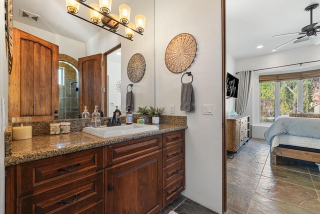 bathroom with ceiling fan and vanity