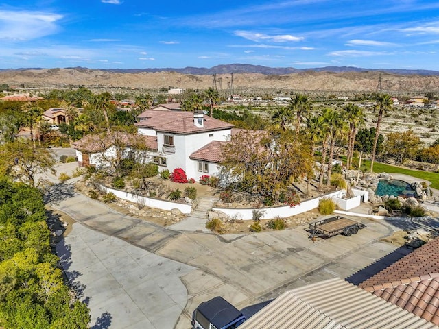 birds eye view of property featuring a mountain view