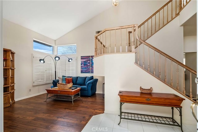 living room with high vaulted ceiling and hardwood / wood-style floors