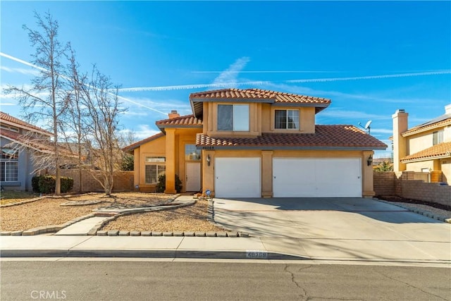 mediterranean / spanish-style home featuring a garage