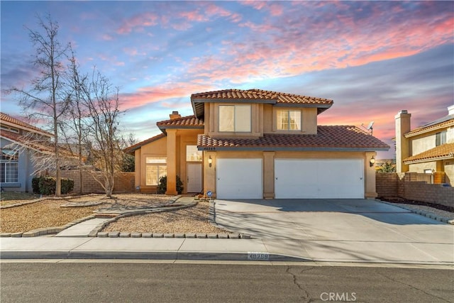 40269 Palmetto Dr, Palmdale, CA 93551 - mediterranean / spanish-style house featuring a garage