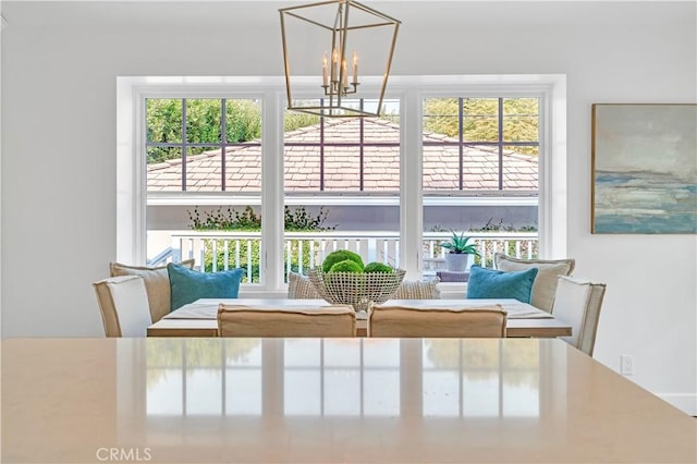 dining room featuring an inviting chandelier and a wealth of natural light