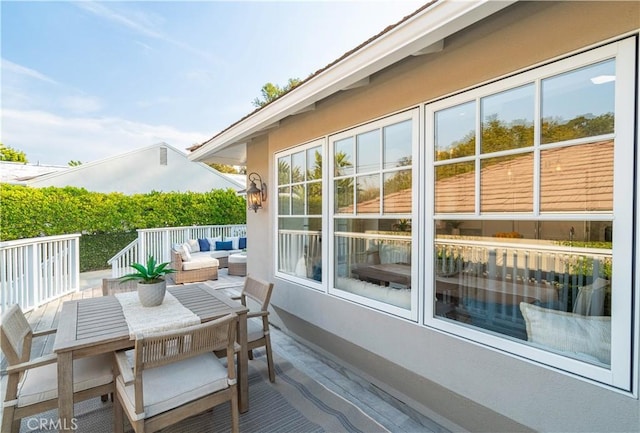 wooden terrace featuring outdoor lounge area