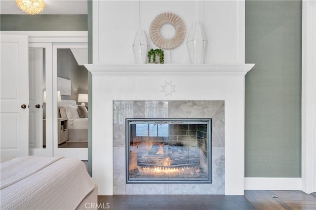 details with hardwood / wood-style floors and a fireplace