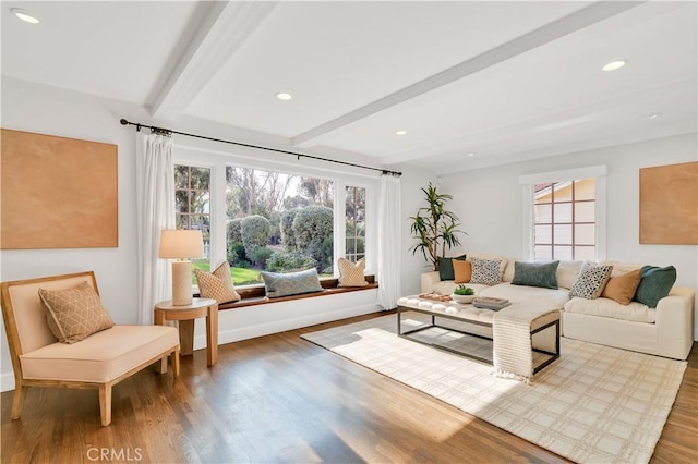 living room with wood-type flooring and beamed ceiling